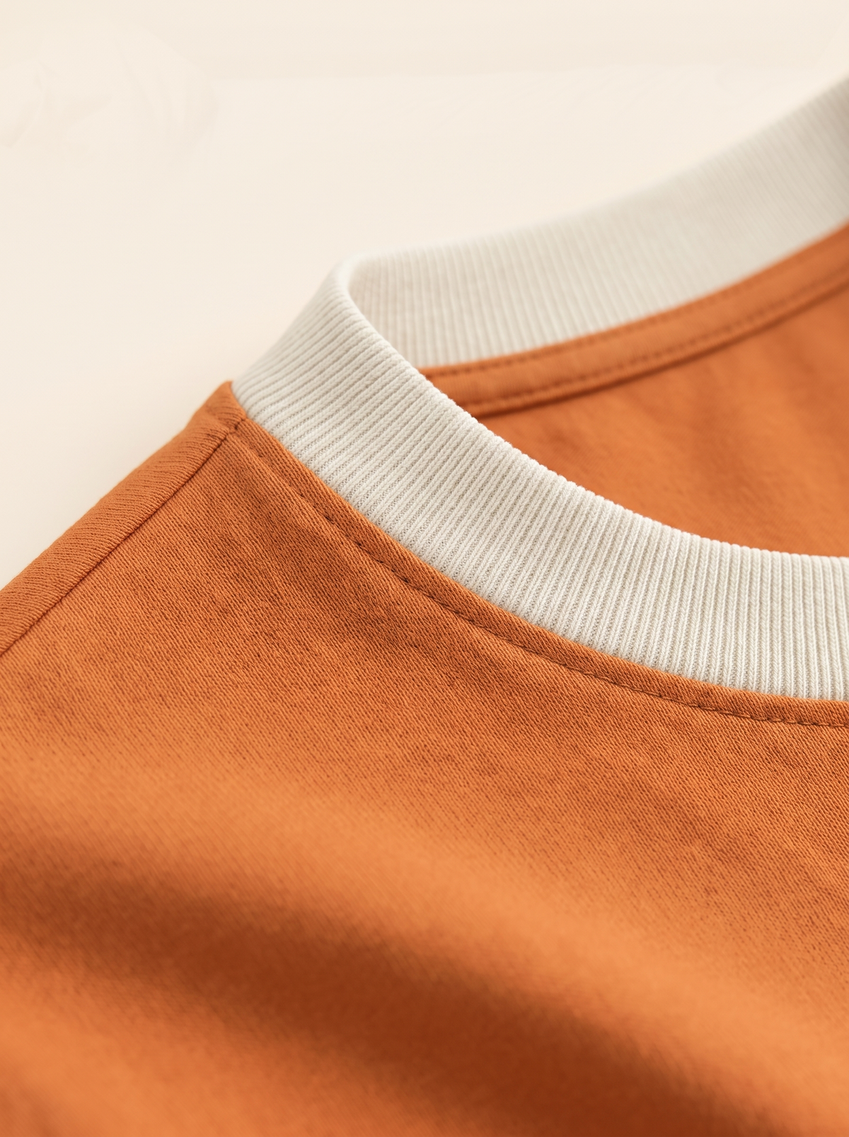 The Basic Tee in Sunrise — collar and fabric detail
