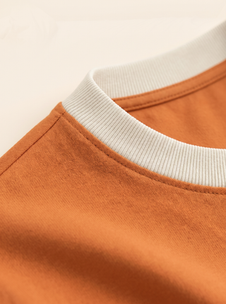 The Basic Tee in Sunrise — collar and fabric detail